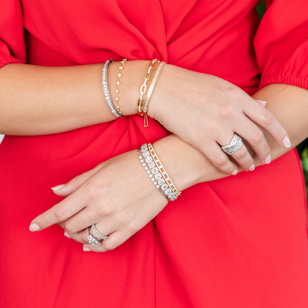 Woman in Red Dress Wearing Gold and Silver Jewelry