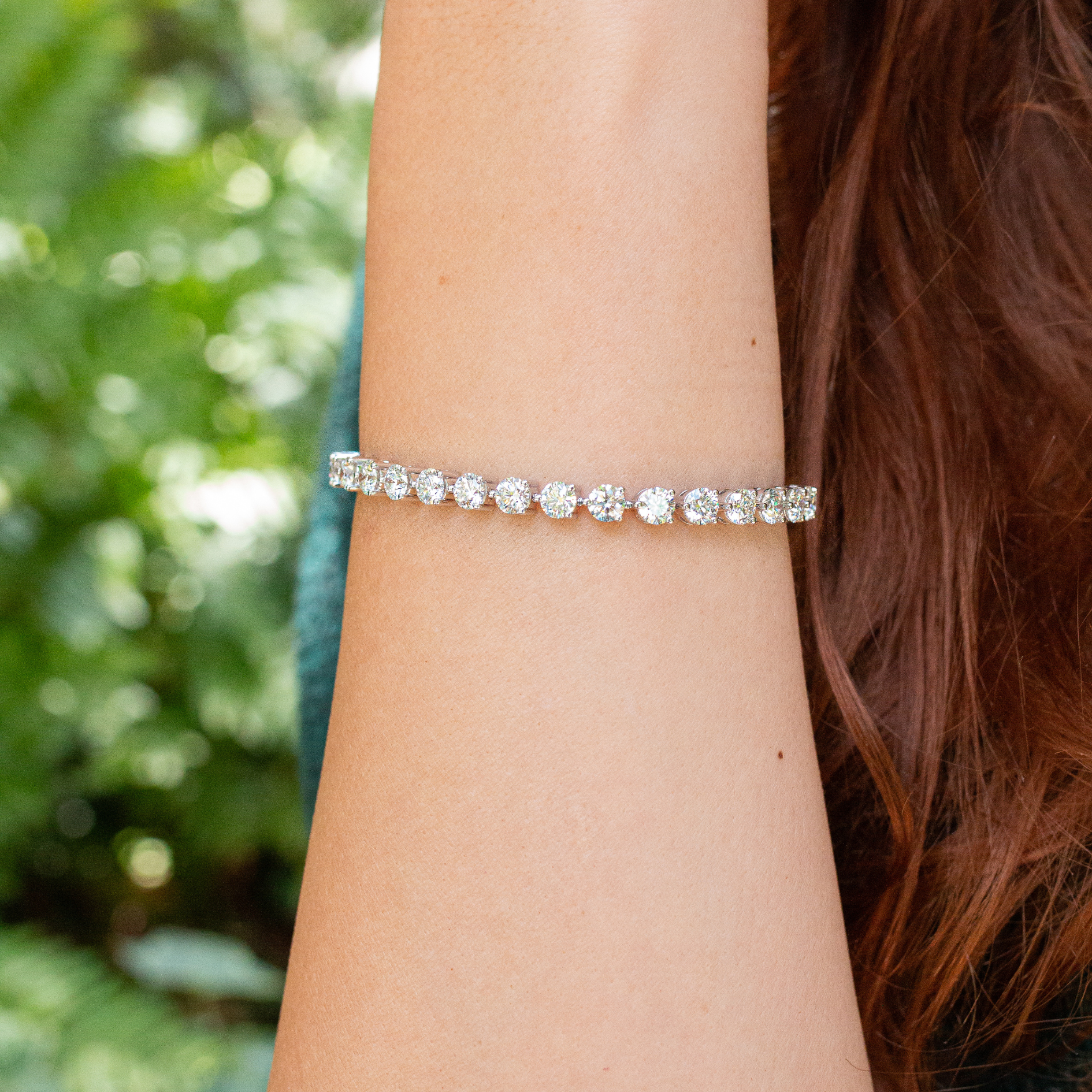 woman wearing diamond tennis bracelet