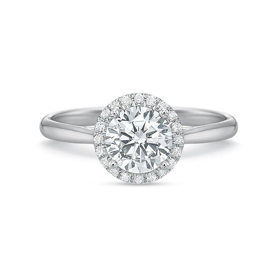 A platinum semi-mount diamond ring with a halo design featuring a central round diamond surrounded by smaller diamonds on the band.