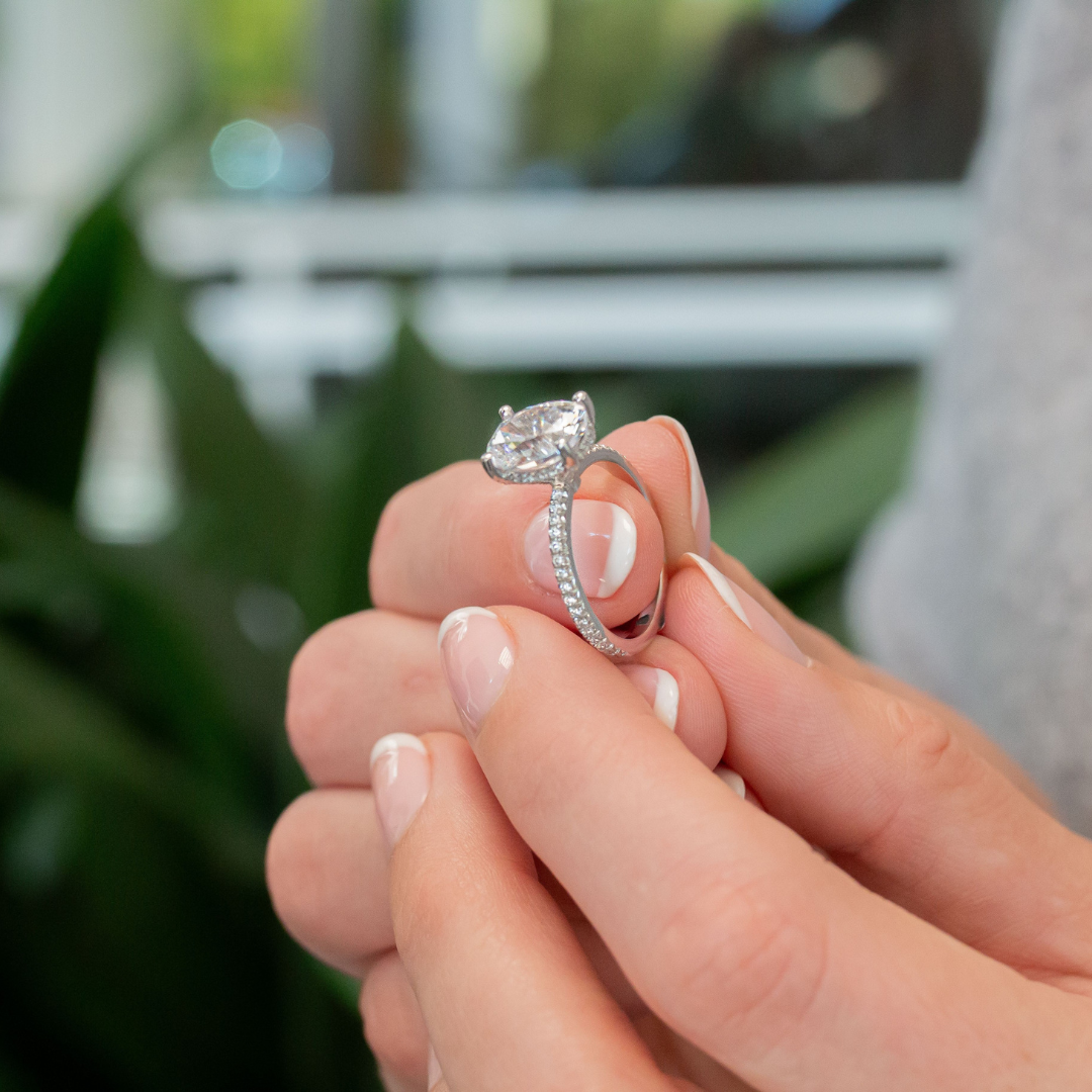 A women holding an engagement ring