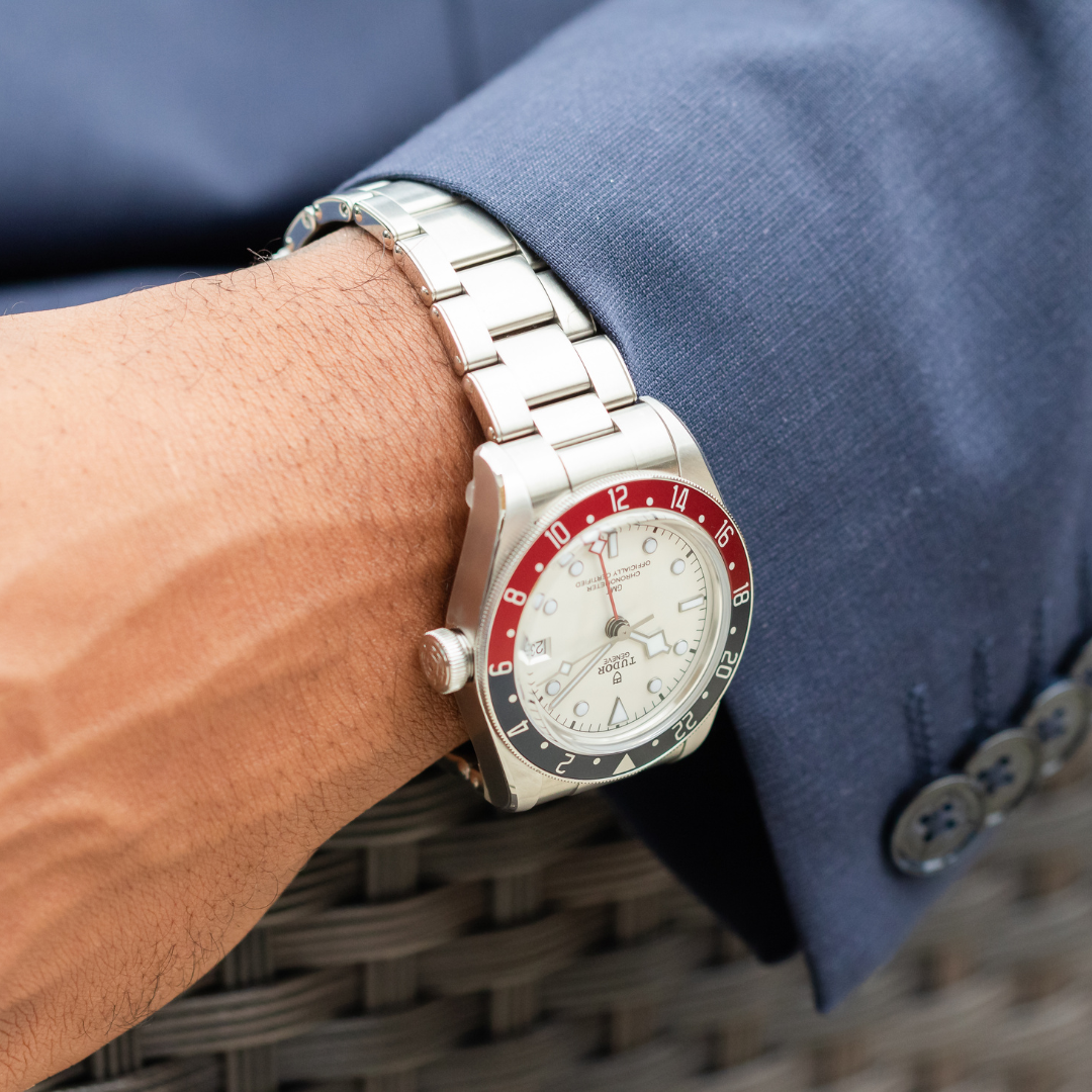 Tudor Black Bay GMT with a white dial on a male's wrist