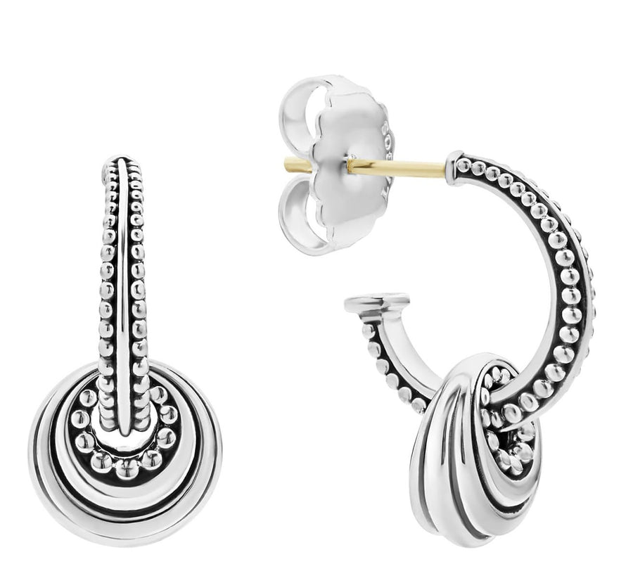 A pair of sterling silver hoop earrings with fluted disc details and beaded accents, featuring a post backing for hoop earrings.