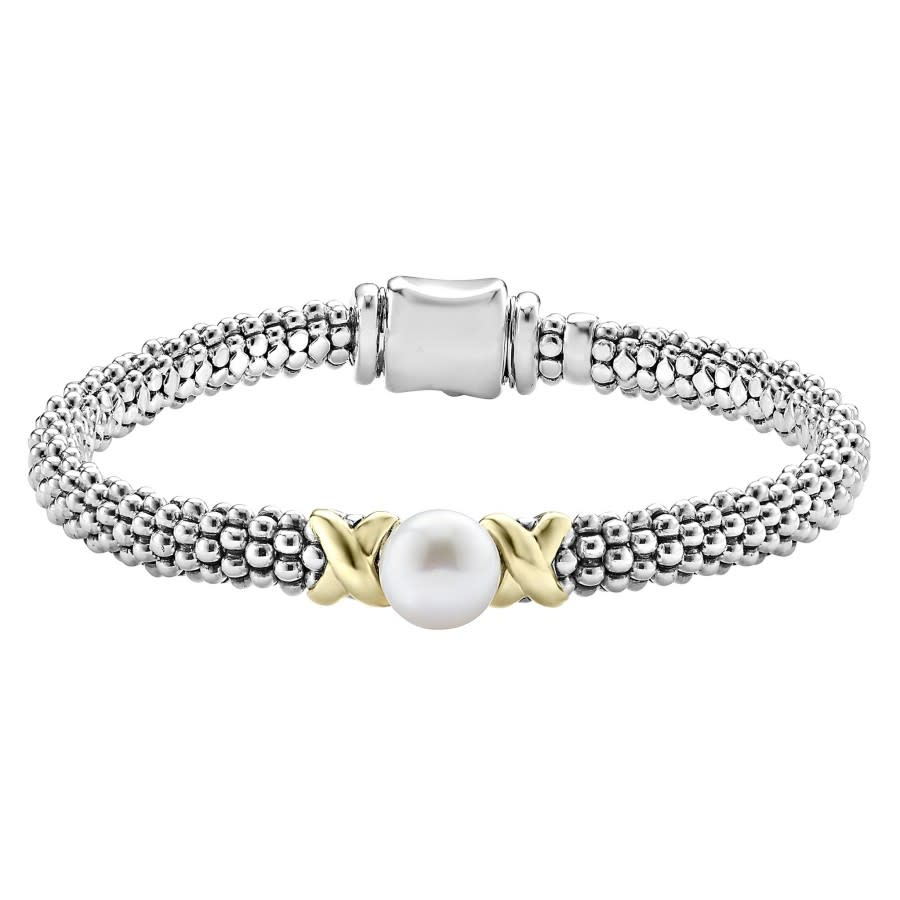 A bracelet featuring a freshwater pearl on a gold and silver rope chain.