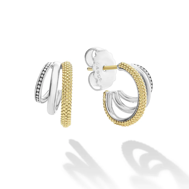 Pair of gold and silver hoop earrings on a white background
