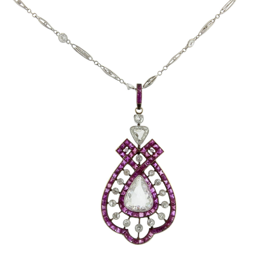 PLATINUM/18KY OLD CUT PEAR DIA=1.00CT J/SI1 TC DIA=0.45 J/SI2 2 RC DIA=0.50CT 83 SQ SC RUBIES=2.00CT PEND