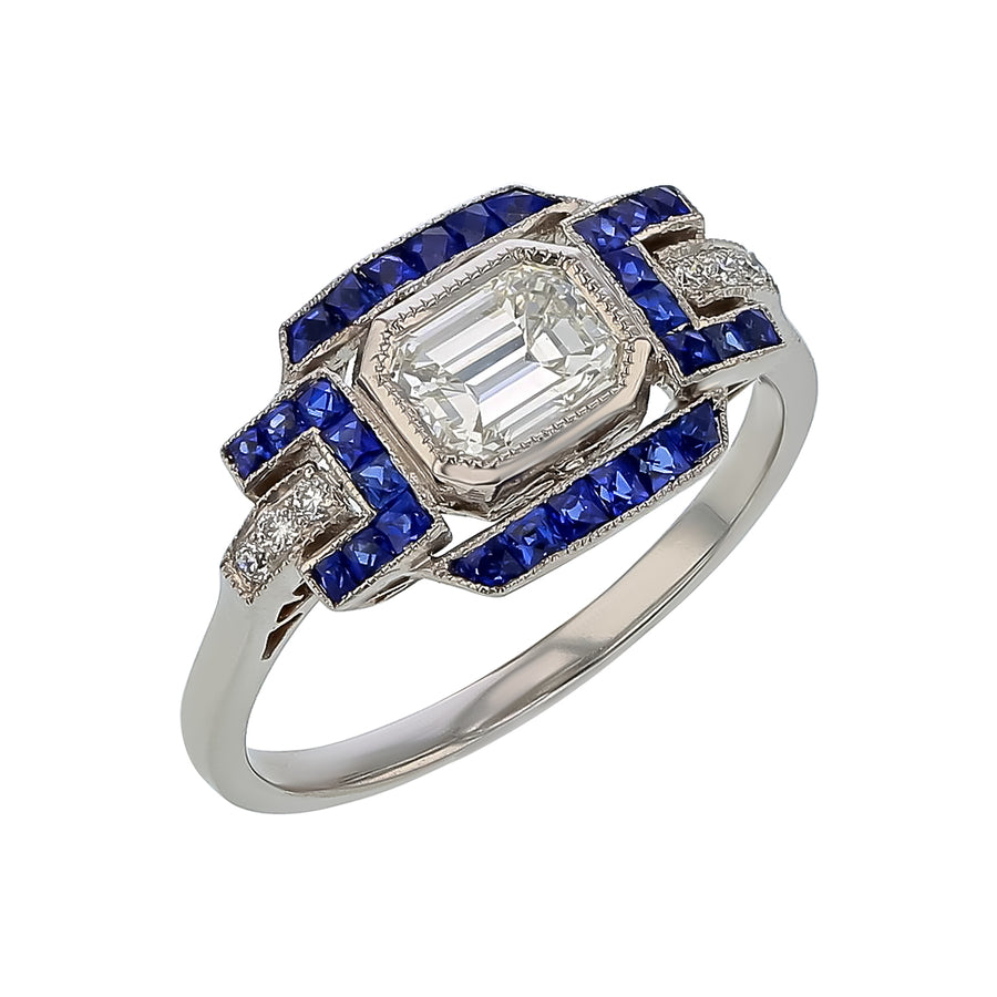 0.70ct Emerald Cut Diamond, 0.05ct Diamond and 0.45ct Sapphire Ring in Platinum, size 6.75