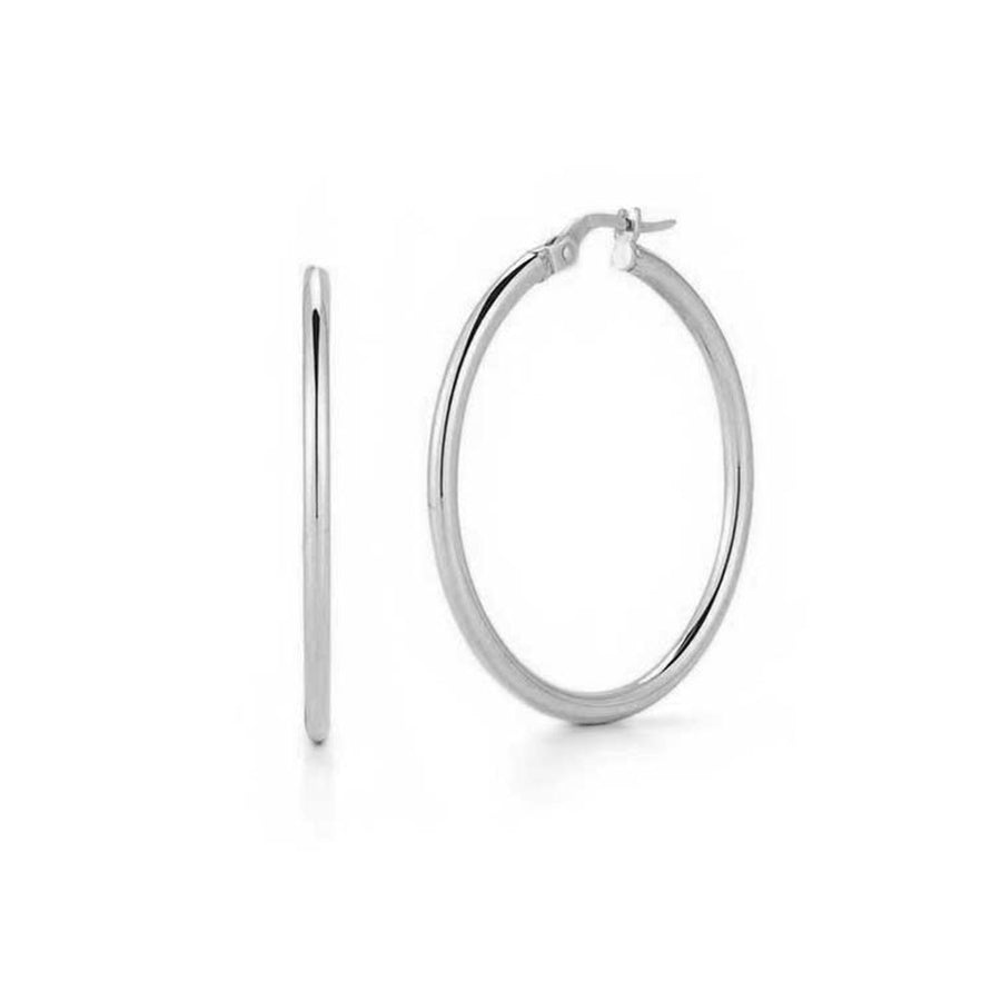 A pair of 35mm hoop earrings in 18K white gold, showing the front view of the earrings with the hooks and the quality of the metal.