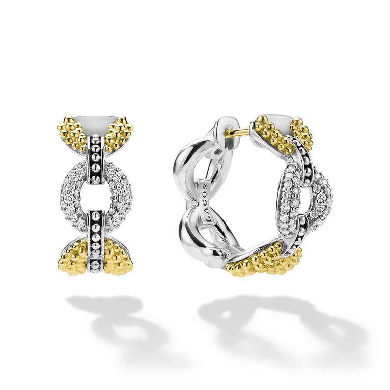 Pair of silver and gold hoop earrings on a white background
