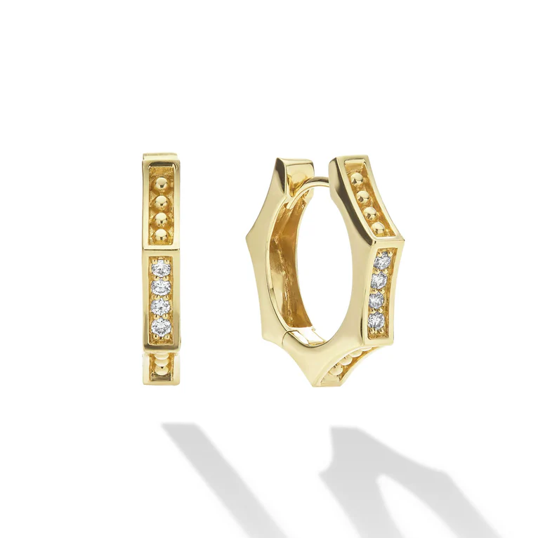 Gold hoop earrings with embedded diamonds on a white background