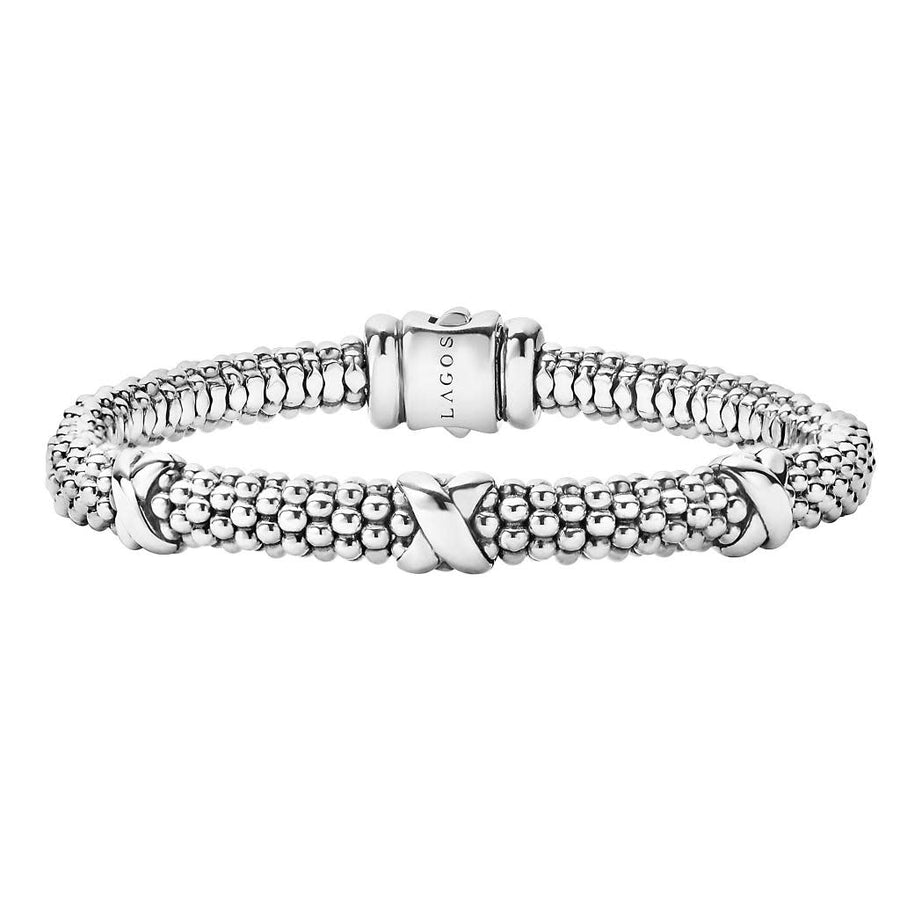 A sterling silver rope chain bracelet with intricate detailing, featuring a medium-sized structure.
