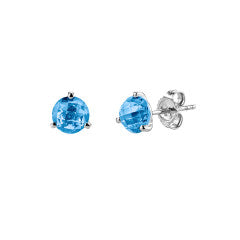 A pair of martini stud earrings featuring round blue topaz stones set in 14K white gold.