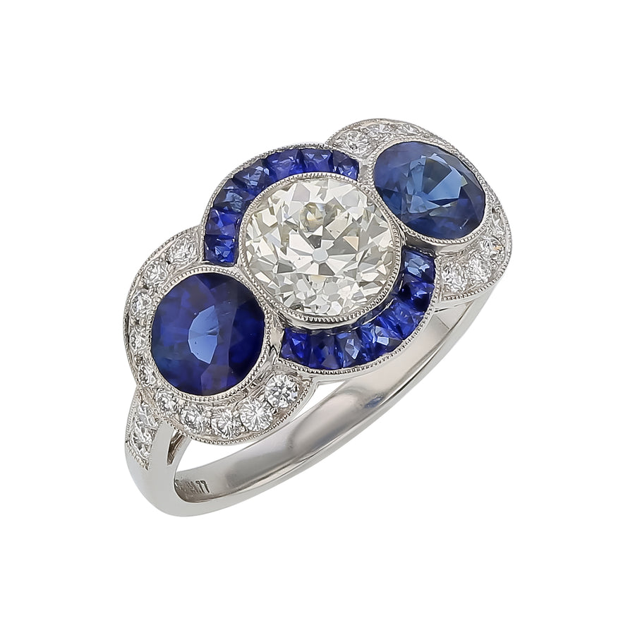 1.23ct Diamond, 2.12ct Sapphire and 0.31ct Diamond 3-Stone Halo Ring in Platinum, Size 6.5