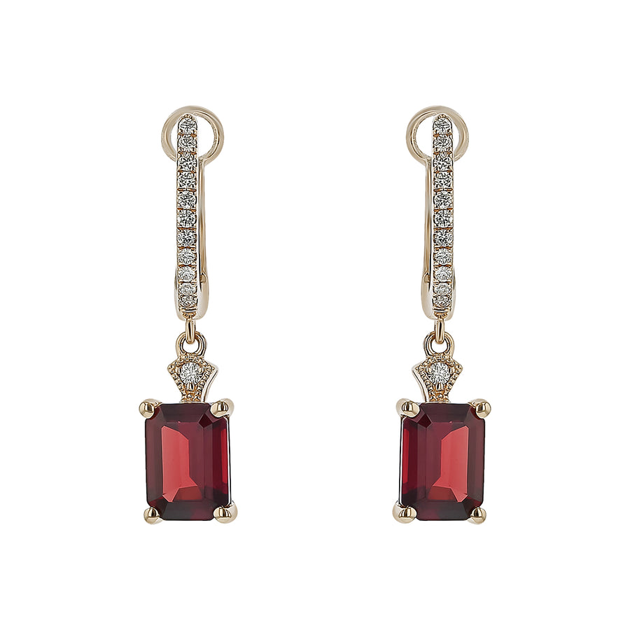 Pair of earrings with red gemstones and gold accents on a white background