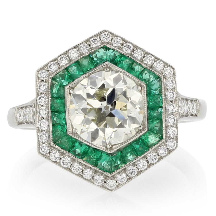 PLATINUM CENTER OLD EUROPEAN CUT DIAMOND=1.47CT 24 SWISS CUT EMER=0.40CT 44 FULL CUT=0.31 HEXAGON RING