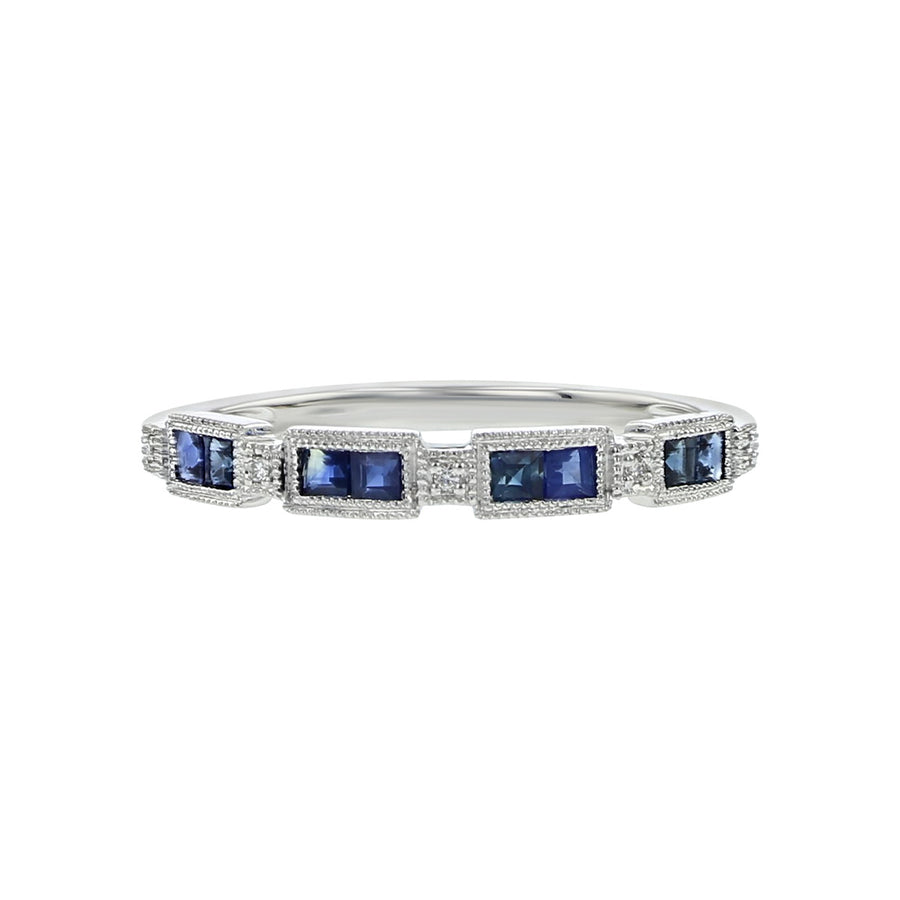 Silver ring with blue gemstones on a white background