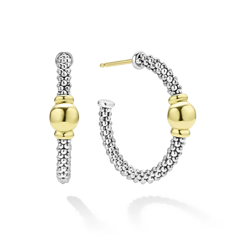 A pair of sterling silver and 18K yellow gold hoop earrings with a geometric pattern.