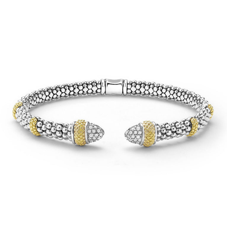 Bracelet with gold and silver beads on a white background