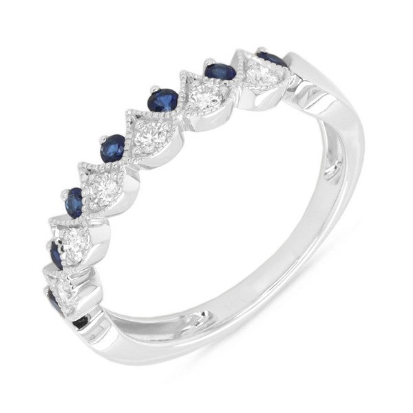 Silver ring with blue gemstones on a white background